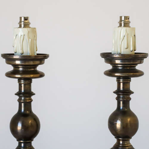 Pair of silvered brass candlesticks later converted to lamps