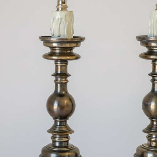Pair of silvered brass candlesticks later converted to lamps