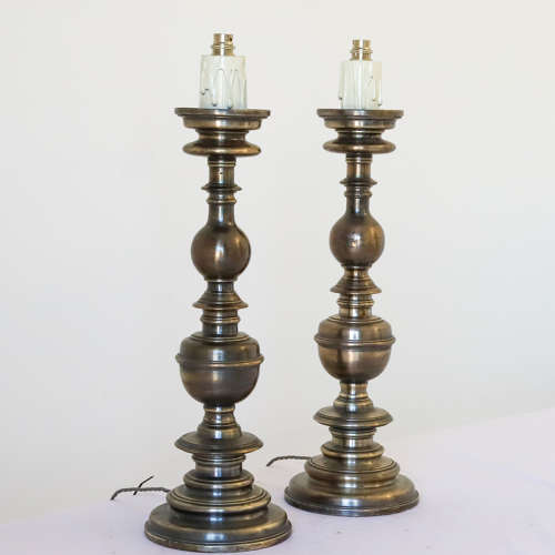 Pair of silvered brass candlesticks later converted to lamps