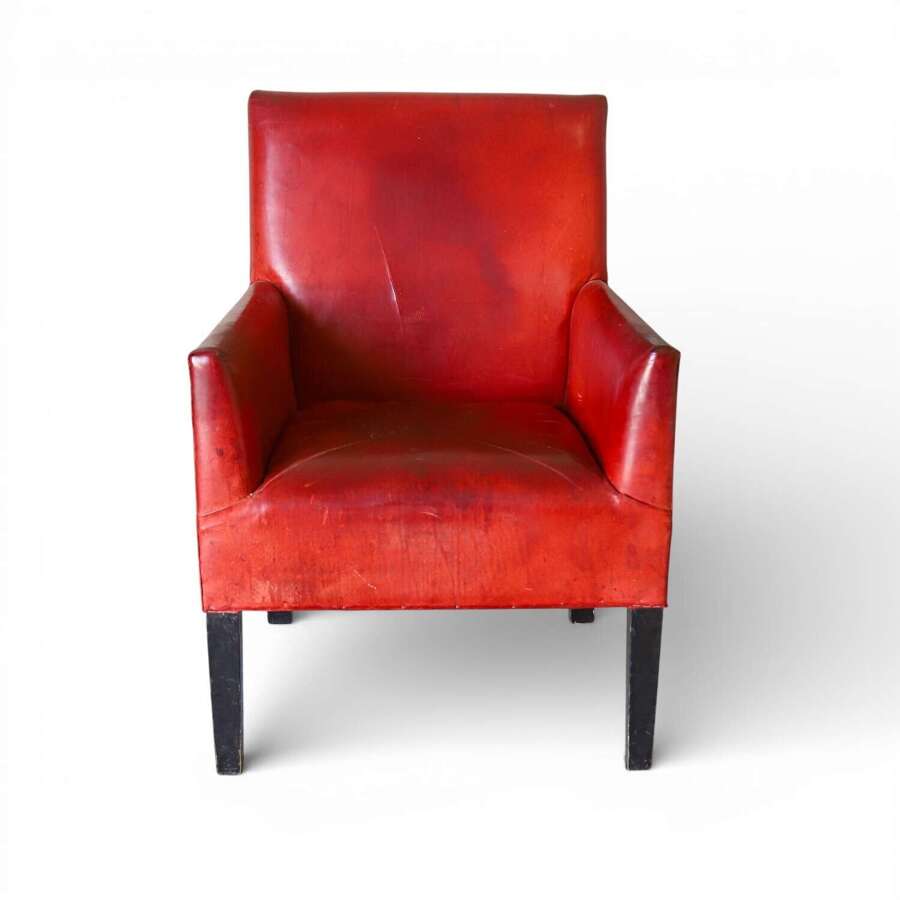 Mid 20th Century Red Leather Armchair on Ebonised Legs &ndash; Vintage Character & Comfort
